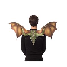 the back of a woman's head with an orange and green dragon wings on it