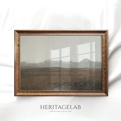 an image of a landscape with mountains in the background and text overlay that reads heritage lab