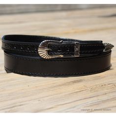 "AU-LC-02-3-BLK Western Leather Hat Band for Cowboy Hats -  Plain Black Leather 3/4\" Wide Tapered to 3/8\" Western Leather Hat Band 3/4\" Wide tapered to 3/8\" Wide with Stitched Edges The hat band is approximately 27 inches, with 10 holes between the 22-25 inch mark. 3-Piece Buckle Set with Antiqued Silver Finish Included Color: Black Adjustable - One Size Fits Most RN: AU-LC-02-3-BLK This Cowboy Hat Band is Made in the USA A Cowboy Hat is not included. This listing is for a black hat band only." Cowboy Hat Band, Cowboy Hat Bands, Leather Hat, Feather Hat, Leather Hats, Western Leather, Black Hat, Hat Band, Plain Black