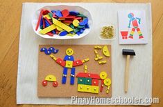 a table topped with lots of crafting supplies on top of a wooden floor next to a paper plate