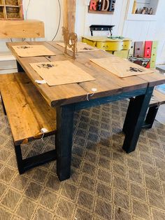 a wooden table sitting on top of a carpeted floor