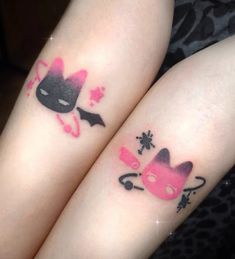 two girls with matching tattoos on their arms, one has a cat and the other has a bat