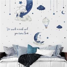 a bedroom with an elephant and moon wall decals on the walls, along with a quote that says we make a wish about you came true