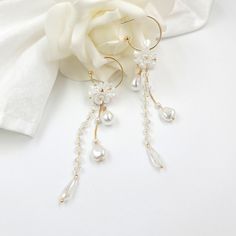 "Beautiful wedding flower earrings - dangle and drop earrings The earrings are made of artificial flowers, pearls, chains, and other trinkets used for arranging. #1   - Total 4.5\" long - 1\" (20mm) outer diameter C post Hoop - 0.4\" Flowers - 0.4\" W x 0.6\" H teardrop pearl - 0.65\" long faceted crystal bead #2  - Total 3.15\" long - 1\" (20mm) outer diameter C post Hoop - 0.4\" Flowers" Hoop Earrings Wedding, Pearls Chains, Cotton Dress Indian, Cherry Blossom Earrings, Pearl Flower Earrings, Drop Earrings Pearl, Flower Hoop Earrings, Earring Pearl, Wedding Earring