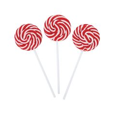 three red and white lollipops sitting on top of each other