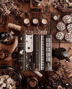 a wooden table topped with lots of different types of cookies and other things on top of it