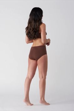 A modern take on a classic silhouette. Feminine and comfortable, the high brief wears well under dresses thanks to its sleek lines while the lightweight, jersey cotton fabric is incredibly soft against skin. Hits just below the belly button. Supportive Seamless Cotton Bottoms, Cotton Seamless Full Coverage Bottoms, Bra-friendly Stretch Shapewear With High-cut Leg, Bra Friendly Stretch Shapewear For Loungewear, Stretch Shapewear, Bra Friendly For Loungewear, Stretch Swimwear For Daywear, Fitted Cotton Brief Bottoms, Fitted Cotton Briefs, Stretch High-cut Leg Shapewear For Loungewear