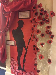 a red and white wall with an image of a soldier on it