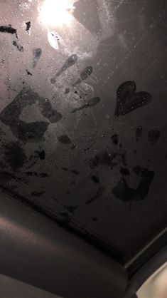 the interior of a car with black paint and scratches on the windshield, from inside