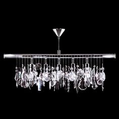 a chandelier hanging from the ceiling in front of a black background