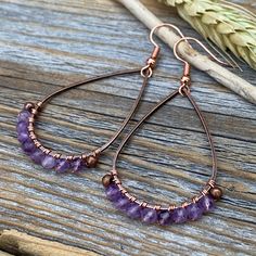 Faceted Amethyst Earrings wrapped with Copper Wire and includes a Nickel Free Ear-Wire: These earrings are light weight, comfortable, simple and fun. Throw them on with any outfit and they will definitely add some pop and sparkle! They are approximately 2.25 inches in length and 1.15 inches at the widest portion. If you would like these in a different color or size, please let me know as I also do customized orders. To view more of my original jewelry designs, visit: https://www.etsy.com/shop/Th Rustic Wedding Jewelry, Wire Wrapped Gemstone Jewelry, February Birthstone Jewelry, Wire Wrapped Stone Jewelry, Original Jewelry Design, Natural Stone Earrings, Basic Jewelry, Earrings Wire, Jasper Earrings