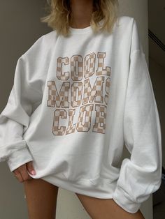 Stay stylish and comfy with our white cotton blend crewneck sweatshirt. Featuring a trendy tan checkered "cool moms club" graphic, this sweatshirt is perfect for any cool mom out there. Elevate your mom game with our comfortable and chic sweatshirt. ☆PROCESSING & SHIPPING: Estimated Time- Products can take up to 1-6 business weeks to be made before being dispatched. Once dispatched the time your item takes to reach you will depend where you are located and what shipping method you choose at checkout. ☆Return Policy: We do not accept returns or exchanges. ☆Wash/Care: Wash + dry as normal trendy preppy girly unique stylish graphic tee sweatshirt graphics checkered cool mom moms mother mama crewneck sweatshirt Casual Cotton Plaid Sweatshirt, Casual Plaid Cotton Sweatshirt, Mama Crewneck Sweatshirt, Cool Moms Club, Games For Moms, Mama Crewneck, Chic Sweatshirt, Cool Mom, Moms Club