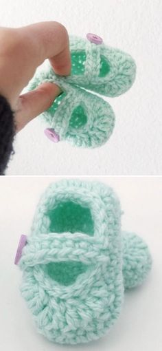 crocheted baby shoes are being held up by someone's hand and the bottom is