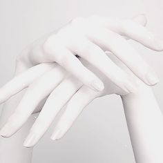 a white mannequin's hand with two fingers on it