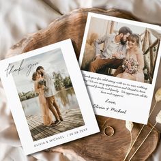 two wedding cards with the same photo on them, sitting on a piece of wood