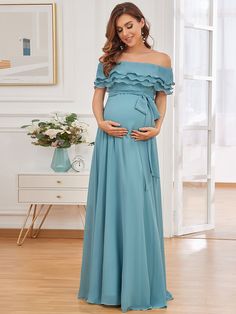 This cute and adorable maternity dress will help you to show off your beautiful baby bump. It features off shoulders, A-line silhouette and frenulum knotting at the waistline. Everyone will surely ask you from where did you get this dress from. Fit: Please refer to Size Chart. Closure: It is Concealed a Zipper Up The Back. Undergarments: It is Not Padded, with No Lining. Fabric: The garment comprises Polyester. Stretch: Fabric is No Stretch. Off Shoulder Maternity Dress, Elegant Maternity Dresses, Maternity Gown, Pregnancy Looks, Pregnancy Wardrobe, Maternity Gowns, Floor Length Skirt, Dress Dusty, Graduation Outfit