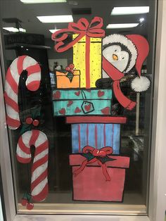 a window display with christmas decorations and gifts