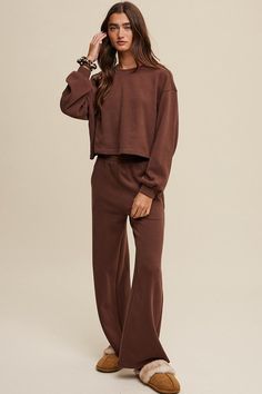 Elevate your loungewear game with our Knit Sweat Top and Wide Leg Pants Athleisure Lounge Set. The cozy knit sweat top features a classic round neck and long sleeves for a relaxed fit, while the wide-leg long pants offer comfort and style. The elastic waist ensures a customizable fit, and the inclusion of pockets on the pants adds a practical touch to the ensemble. - Model is 5' 10" 32-26-35 and wearing a size Small Style: Casual Print / Pattern: Plain Silhouette: Lounge Sets Fit: Regular Embell Top And Wide Leg Pants, Knit Lounge Set, Sweat Top, Top And Pants Set, Cozy Knit, Lounge Set, Lounge Sets, China Fashion, Cozy Knits