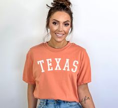 "Are you a Texas Gal or Pal?? Rep your favorite State with this Retro Texas T-Shirt. 💎 PREMIUM MATERIALS -- Crafted from the finest ultra-soft Comfort Colors fabric ensures that you'll feel cozy and at ease all day long, empowering you to take on the world with confidence.  👕 VINTAGE MODERN STYLE -- Takes a nostalgic nod to vintage aesthetics, while adding a modern twist that sets it apart from the crowd. With its bold text proudly displayed across the chest, the uplifting message of \"Stay Ha Cute Spring College Tops, Cute Tops For College In Spring, College Tops With Funny Text And School Spirit, College Tops With Funny Text For School Spirit, Cute Spring College T-shirt, Cute Short Sleeve Tops For College, Texas Shirt, Choose Happiness, Eagle Mountain