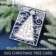 a christmas tree card with the words svg christmas tree card on it, surrounded by evergreen branches