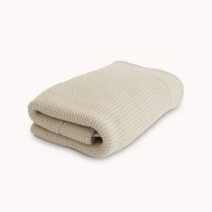 a white blanket folded on top of each other