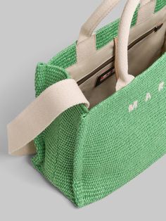 East-West small tote bag in weaved fabric. Two sets of handles in cotton ribbon, short for hand carry, long for shoulder carry. Fabric Lining with zipped pocket. Palladium Hardware. Embroidered Marni logo on the front. Green Double Handle Bags For The Weekend, Green Double Handle Bags For Weekend, Weekend Rectangular Shoulder Bag With Leather Handles, Eco-friendly Rectangular Shoulder Bag For Weekend, Green Rectangular Bag With Rolled Handles, Woven Bags With Double Handle For Errands, Woven Double Handle Bag For Errands, Embroidered Tote Bag, Embroidered Tote