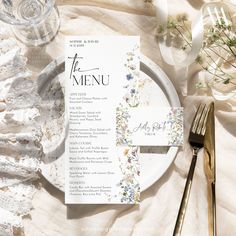 a table setting with place settings and silverware