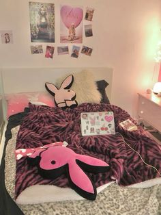 a bed with pink and black decorations on it