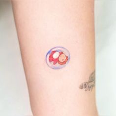 a person with a small tattoo on their arm