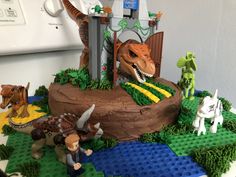 a cake made to look like legos and dinosaurs