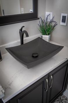 The Eden Bath deep Zen above counter, vessel sink in lava stone (volcanic rock) is a perfect balance between the ultra-chic Zen sinks and a practical rectangular shaped basin. This stone sink features a honed finish, which gives it a duller, more matted look than its polished counterparts. The deep Zen sink still provides a modern serene look with its clean lines and rising arches, while offering enough depth to be completely practical for a bathroom or powder room that is often used. We recomme Black Marble Bowl Sink, Black Vessel Sink Bathroom, Powder Room Ideas Modern, Vessel Sink Ideas, Small Dark Bathroom, Black Modern Bathroom, Above Counter Bathroom Sink, Stone Bathroom Sink, Dark Bathrooms