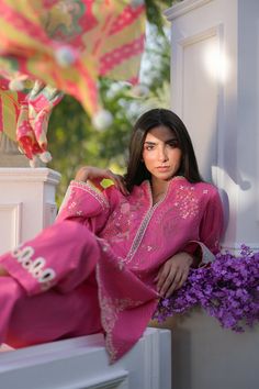 A bubblegum pink jacquard lawn base is rendered with delicate floral embroidery in hues of blush pink, ivory and sage green. Intricate eyelet details adorn the scalloped daaman and matching culottes. Paired with a painterly printed sage green and peach medium silk dupatta. Pink Floral Print Palazzo Set For Eid, Traditional Pink Floral Print Lawn Suit, Traditional Pink Lawn Suit With Floral Print, Pink Lawn Suit With Floral Embroidery For Eid, Summer Pink Palazzo Set With Chikankari Embroidery, Summer Pink Sets With Chikankari Embroidery, Pink Embroidered Lawn Suit, Pink Floral Embroidered Lawn Suit For Summer, Summer Pink Lawn Suit With Floral Embroidery