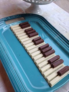 chocolate and marshmallows are arranged on a blue tray