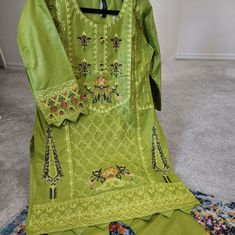 2 Piece Embroidered Linen Dress Traditional Green Fall Dresses, Embroidered Cotton Sets For Fall, Green Cotton Dress For Eid, Green Embroidered Dress With Resham For Summer, Green Cotton Dress With Intricate Embroidery, Green Embroidered Dress For Spring, Green Summer Dress With Resham Embroidery, Fitted Embroidered Sets For Spring, Embroidered Fitted Sets For Spring