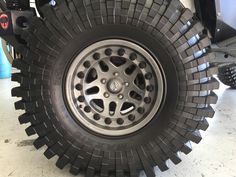 the wheel and tire of a vehicle in a garage