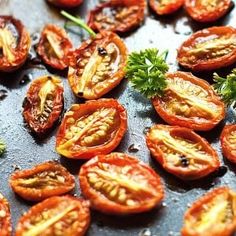 sliced tomatoes and parsley on a baking sheet