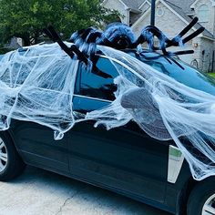 a car with spider webs on the windshield