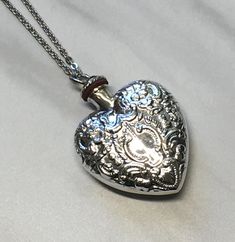 This is a Sterling silver hollow pendant necklace.  The top screws off and the cavity can hold perfume, ashes, sand, essential oil or anything that you want close to you.  It measures 40mm in height and 30mm wide and weighs approx. 12.5 grams.  Comes on a silver plated cable chain that you can pick the length .  Free shipping through USPS First class mail. Heart Perfume, Essential Oil Necklace, Funky Jewellery, Perfume Necklace, Essential Oil Necklaces, Pretty Accessories, Ashes Necklace, Antique Perfume, Bottle Necklace