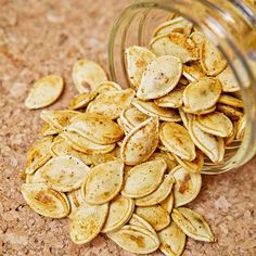 a glass bowl filled with sliced pumpkin seeds