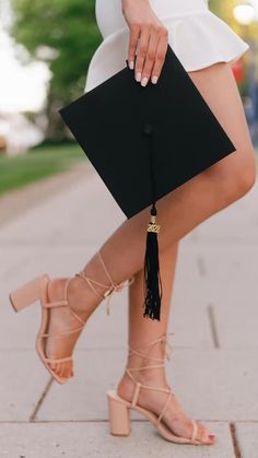 a woman in high heels and a black clutch bag