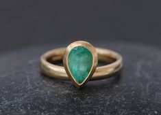 18K Gold Natural Pear Cut Emerald Ring. Beautiful natural emerald set in a satin finished 18K yellow gold. 9 X 6mm approx 1.3 carat pear cut natural Colombian emerald. A medium tone of green with a strong saturation.  The ring band is 3mm thick and the stone bezel is 9mm across. This is a made to order ring, please let me know your ring size when you place your order. If you would like a different colour gold, please let me know and i'll be happy to help. Your ring comes in a gift box with a bla Pear-shaped Gold Emerald Ring, Pear-shaped Yellow Gold Emerald Ring For Anniversary, Pear-shaped Emerald Ring In Yellow Gold For Anniversary, Pear Shaped Emerald Ring In Yellow Gold For Anniversary, Engagement Ring On Hand, Contemporary Handmade Jewelry, Citrine Ring Engagement, Emerald Set, Emerald Band