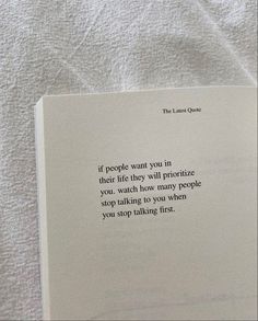 an open book sitting on top of a bed covered in white sheets and text that reads, if people want you in their life they will provide you