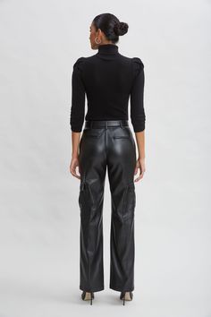 Luxe Vegan Leather lends a chic expression to the season's must have Cargo Pant. The relaxed fit, pintuck details & cargo pockets are the definition of sporty cool. Get ready for the compliments. Elie Tahari Exclusive Vegan Leather Cargo Pants 50% Polyester, 50% Polyurethane Relaxed Fit; Runs true to size. Model is 5'9" and wearing size 2 Measurements: Front Rise: 11"L , Inseam: 32.75"L (approx. length for size 6) Dry clean Imported Style #: E90AM214