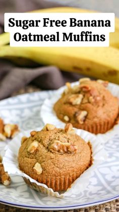 two muffins sitting on top of a white plate next to some banana's