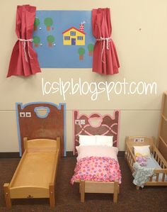 there is a dollhouse bed and two beds in the room