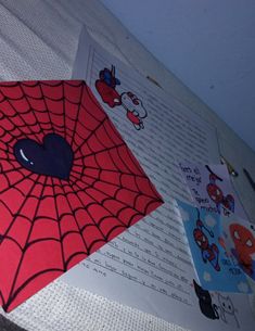 there is a spider web on the sheet of paper with stickers attached to it