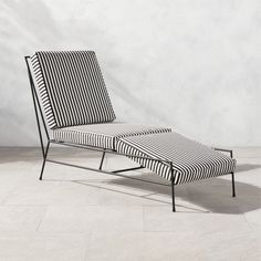 a black and white striped chaise lounge chair