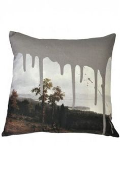 a pillow with an image of trees on it