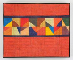 an orange quilt with multicolored squares and lines in the center, on a white background