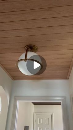 a ceiling light that is on the side of a door